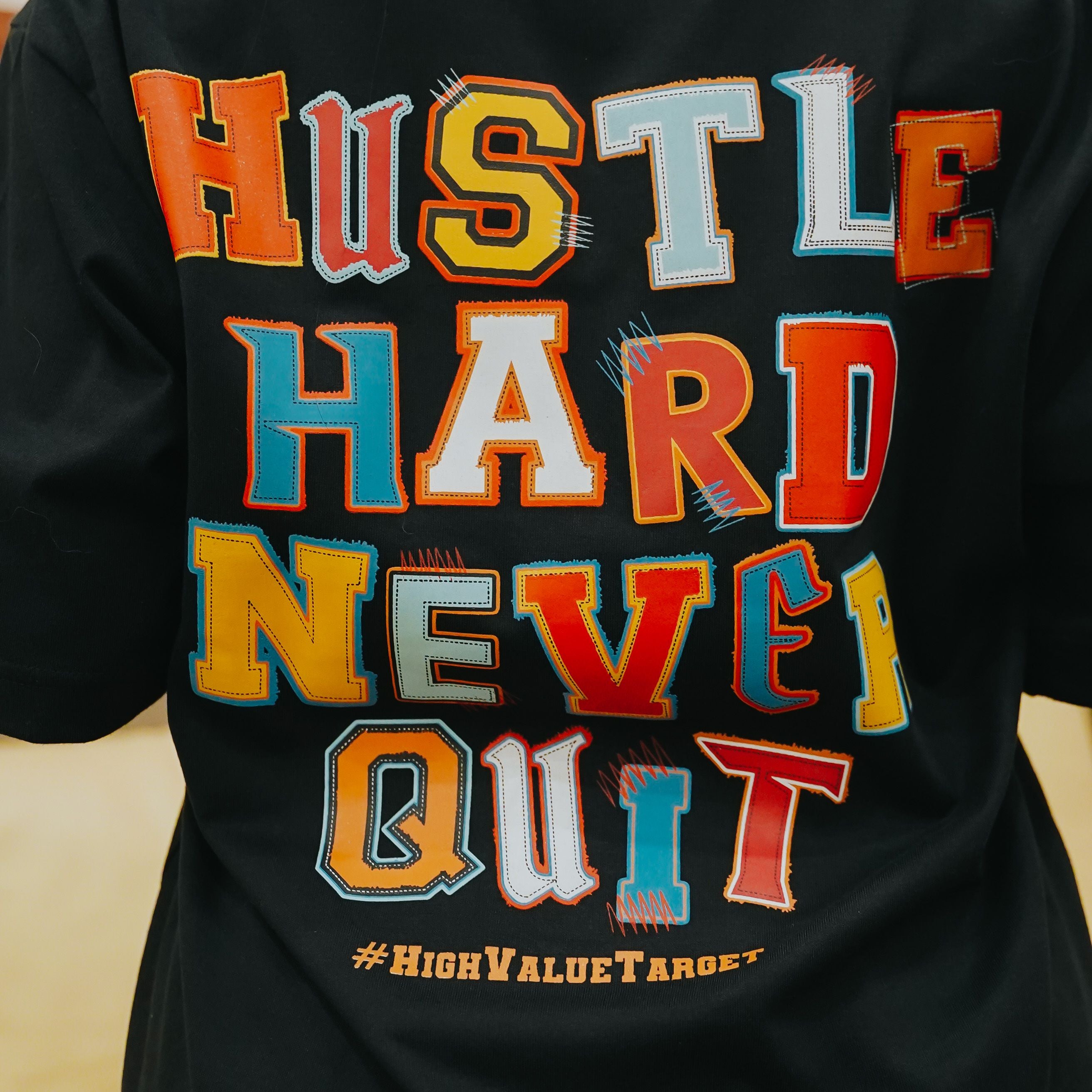 HIGH VALUE TARGET "HUSTLE HARD NEVER QUIT " BLACK CVC COTTON UNISEX T-SHIRT