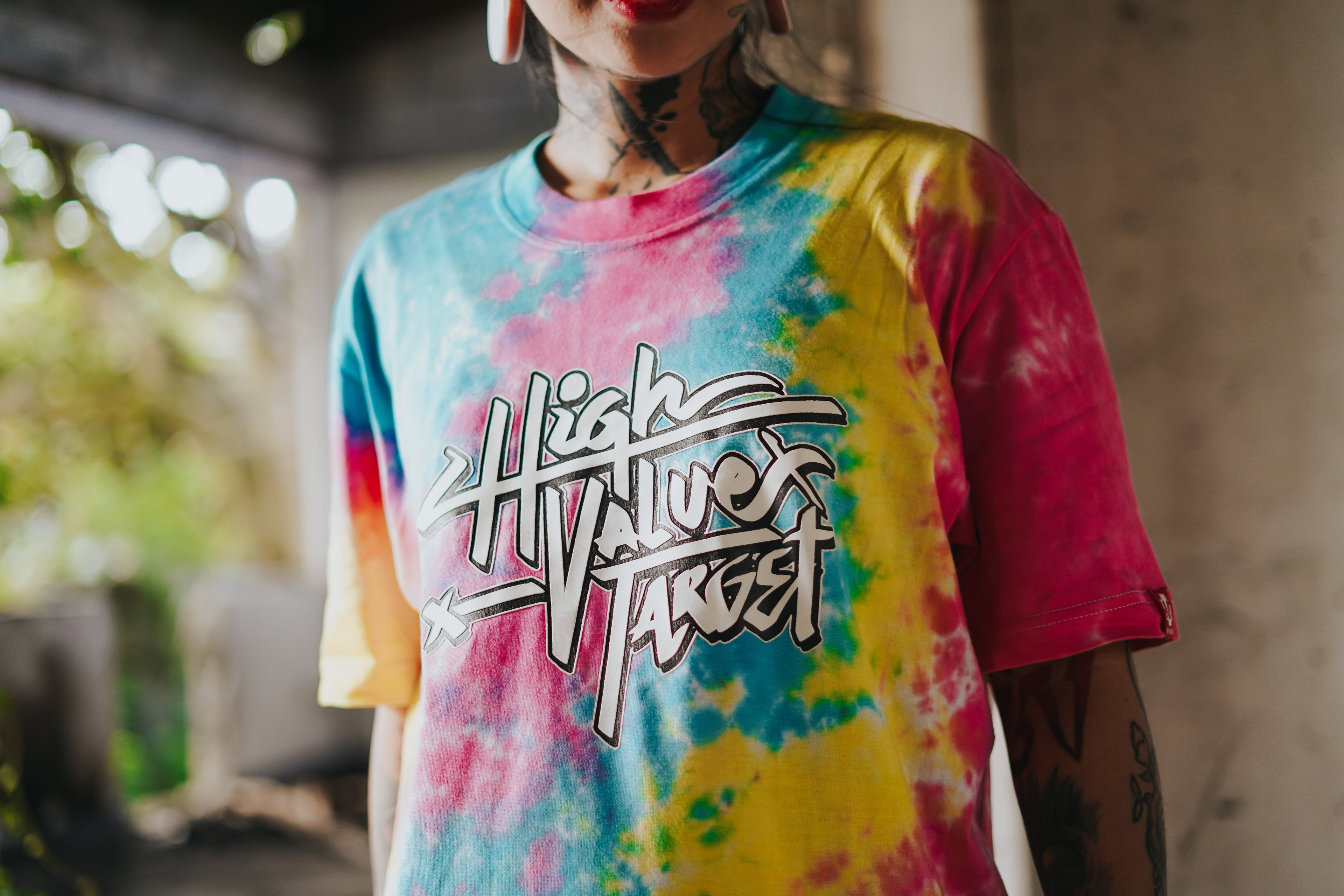 Pastel tie dye t-shirt with High Value Target text on chest, soft blended colors with modern streetwear style design
